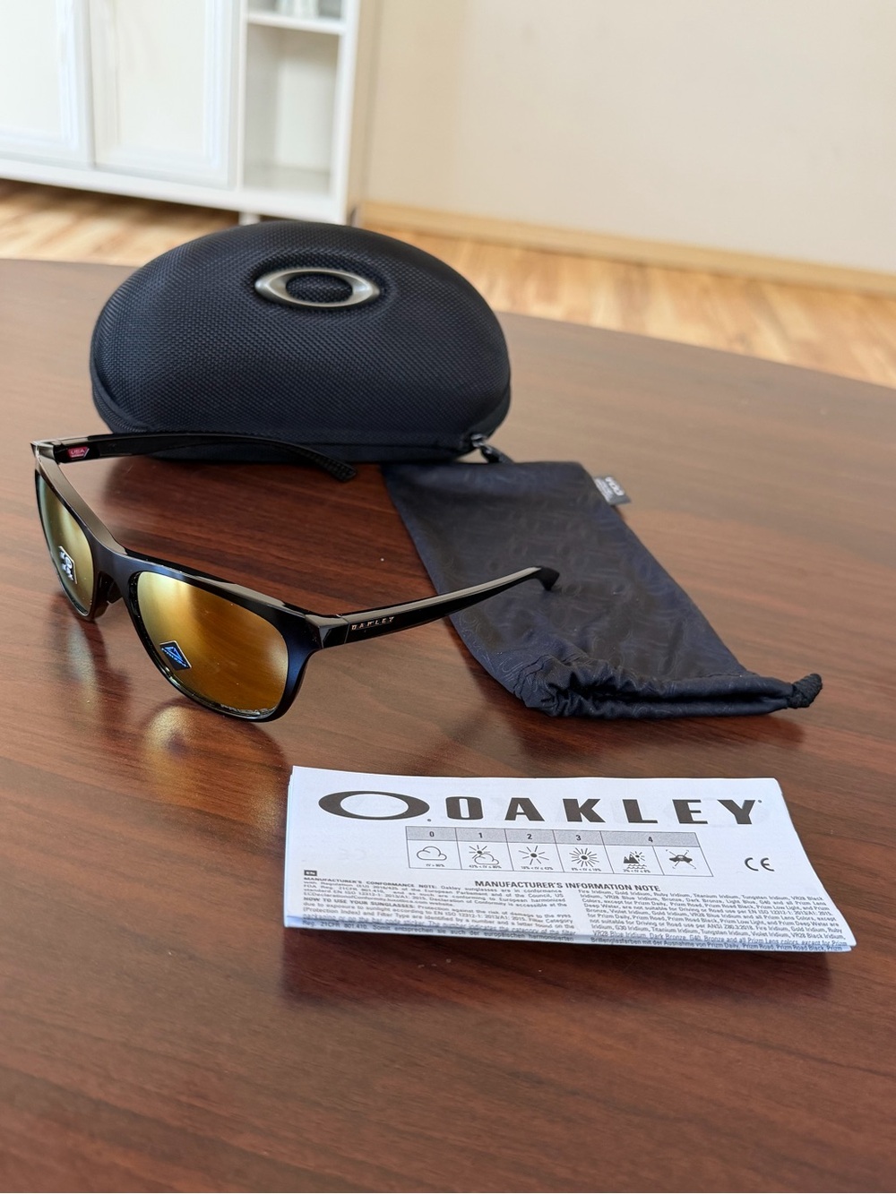 Oakley Men's Black Frame Sunglasses with Gold Iridium Lenses